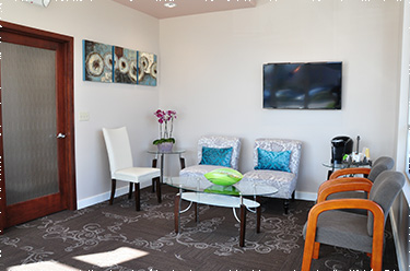 Clear, bright photo of front desk, showing the front desk staff