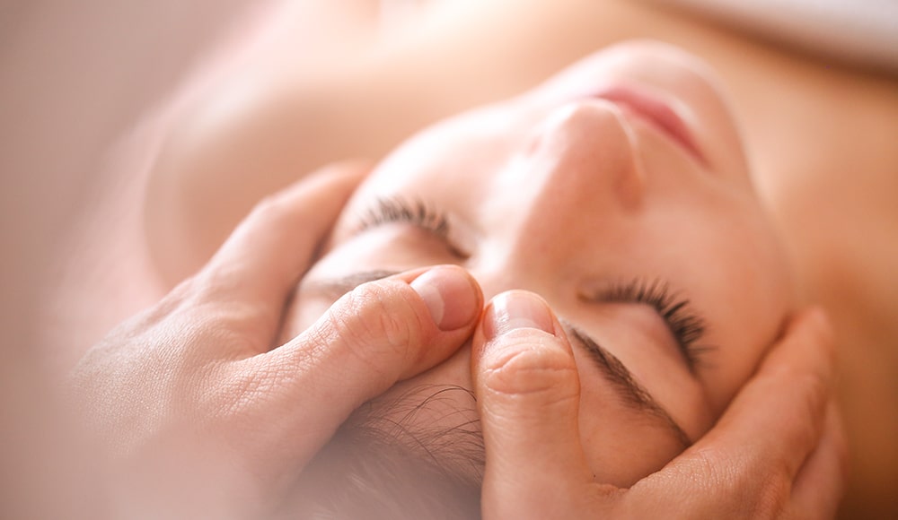 Woman getting a head massage